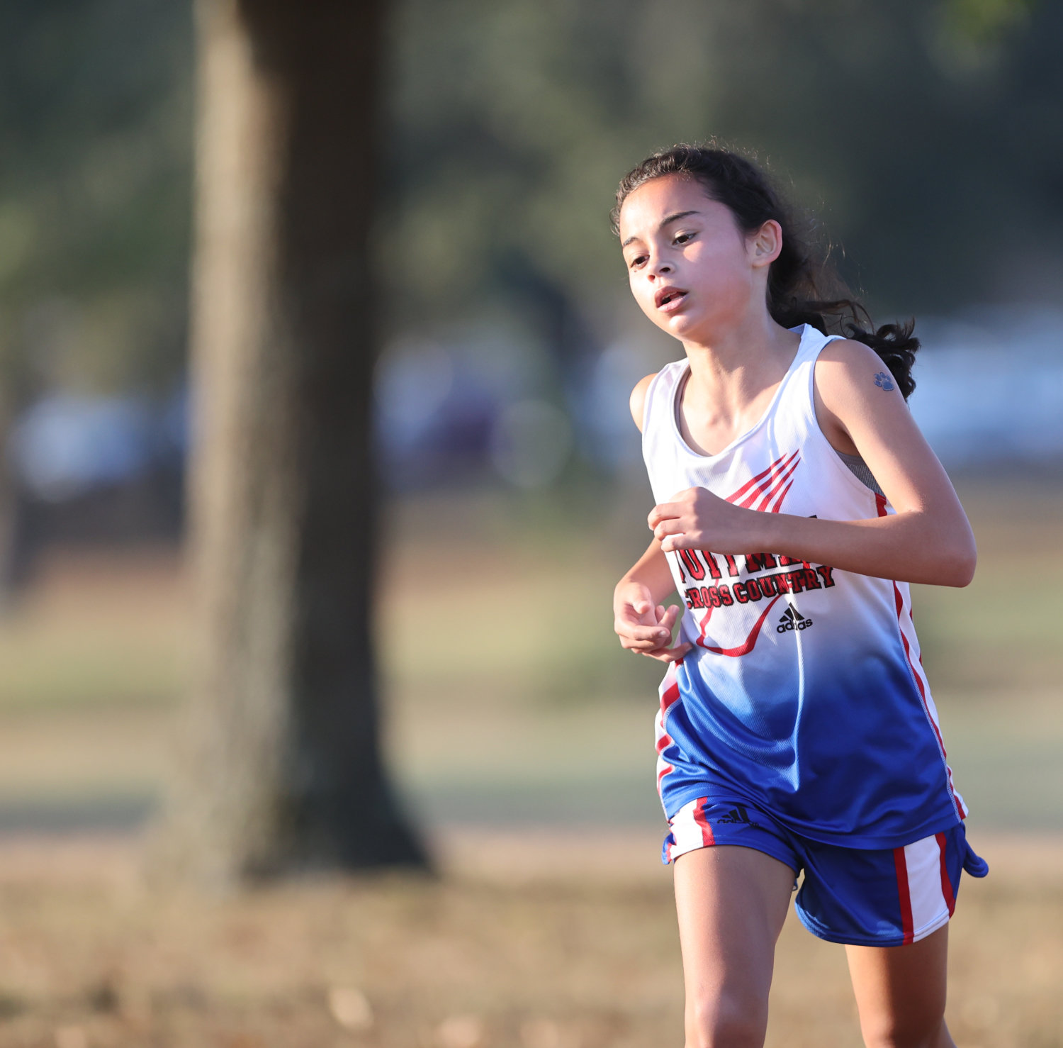 Quitman runner Katie Degorostiza led the district champion Lady Bulldogs with a winning time of 13:02 Saturday morning.